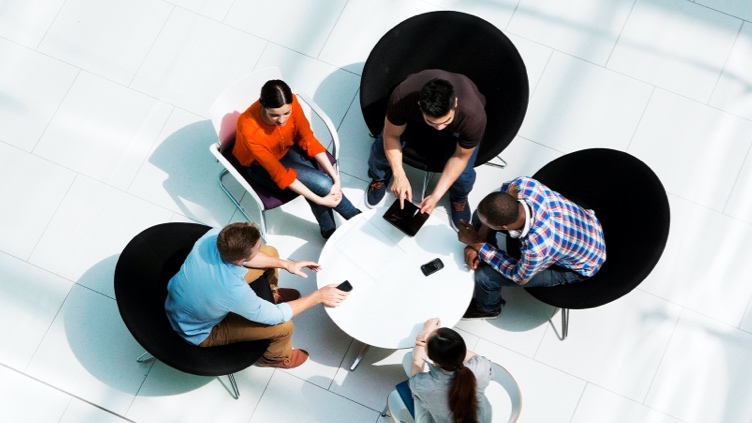 Co-workers around a table.