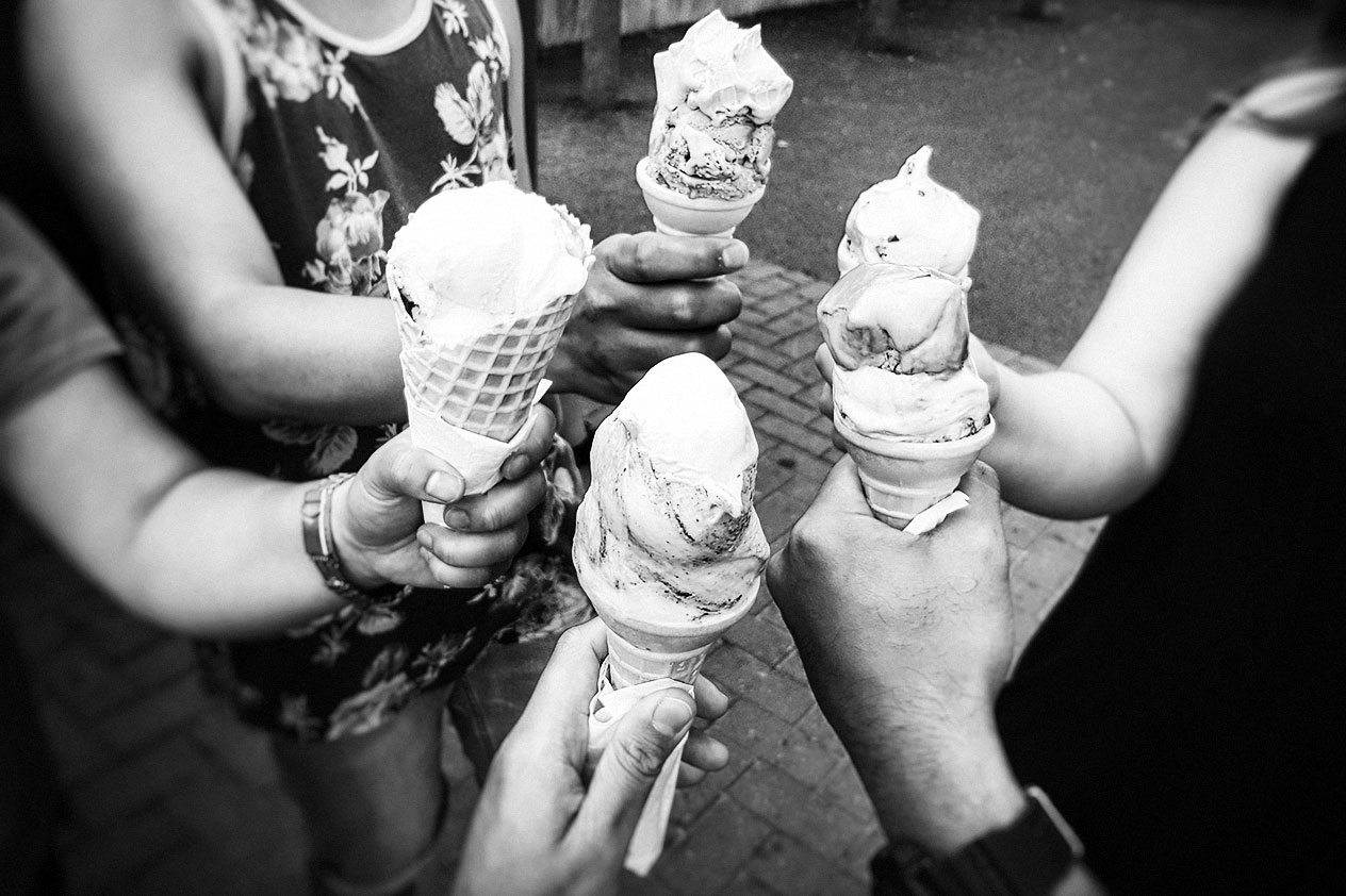 Hands holding ice cream cones