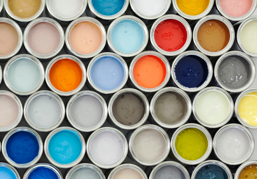 An overhead photo of different open paint cans