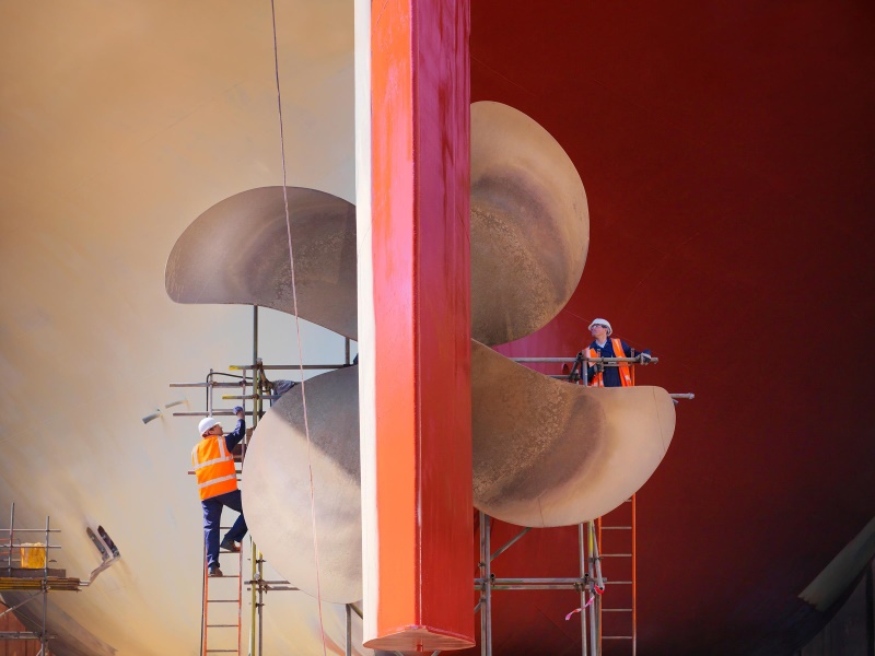 Engineers working on airplane turbine