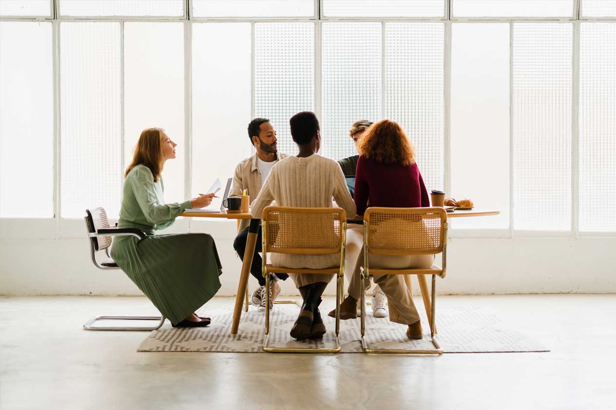 People sitting on a table chatting