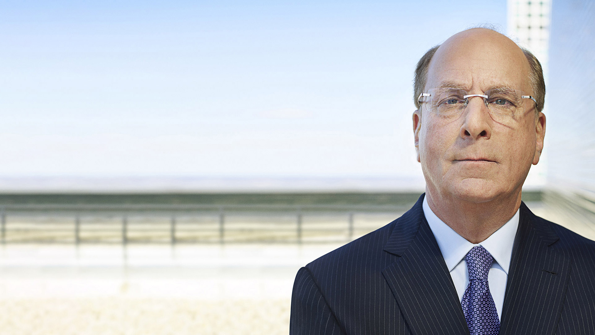 A close up shot of Larry Fink, BlackRock CEO, looking directly at the camera 