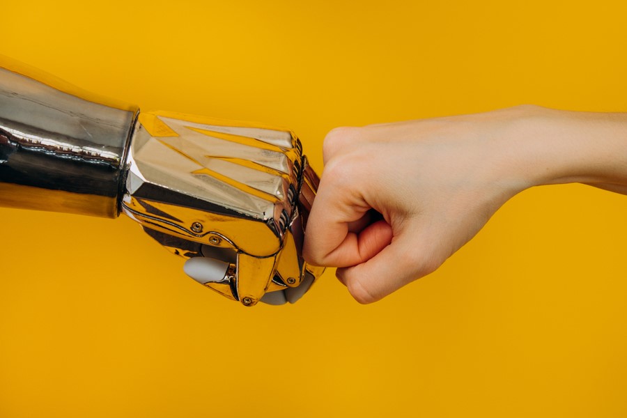 bionic robot arm and the human arm are knocking fists