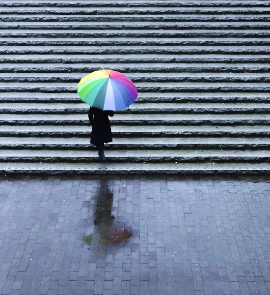 Woman holding and umbrella