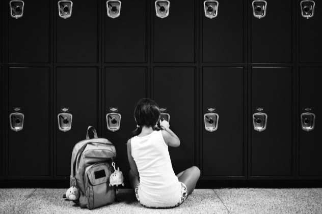 Child investigating lockers