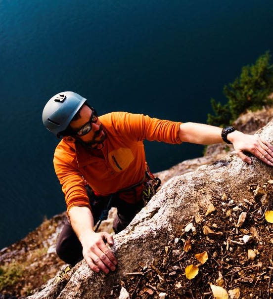 Man scaling rock