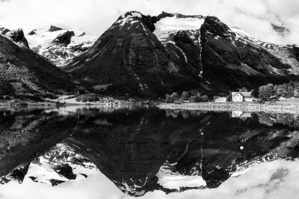 mountain covered with ice behind a lake