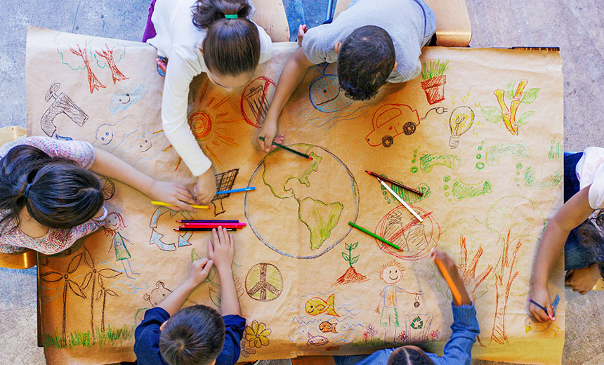 Children sitting around a table drawing