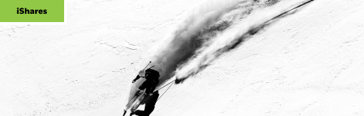 Woman skiing down a mountain at speed