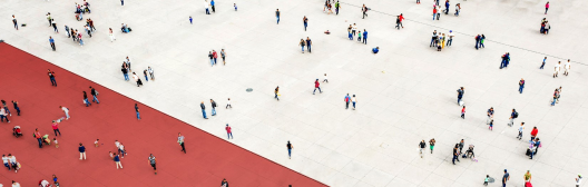 group of people scattered across red and white area