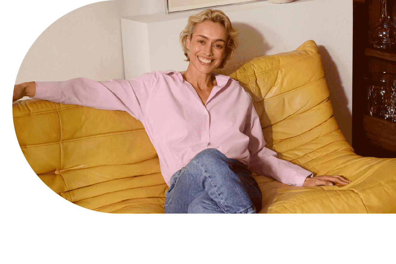 woman sitting relaxed on a yellow couch