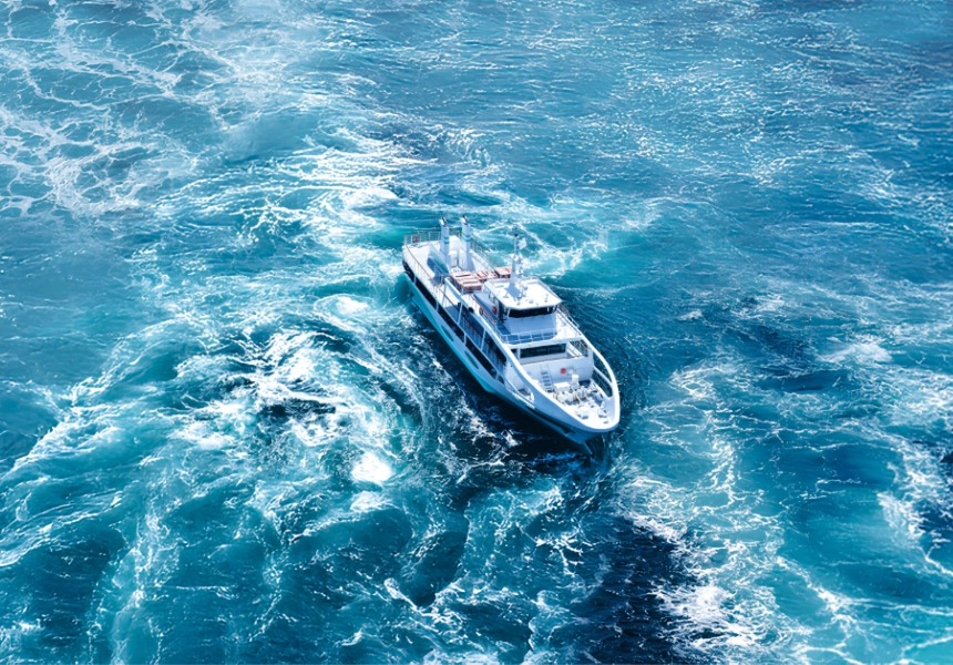 A cruise ship navigating volatile sea