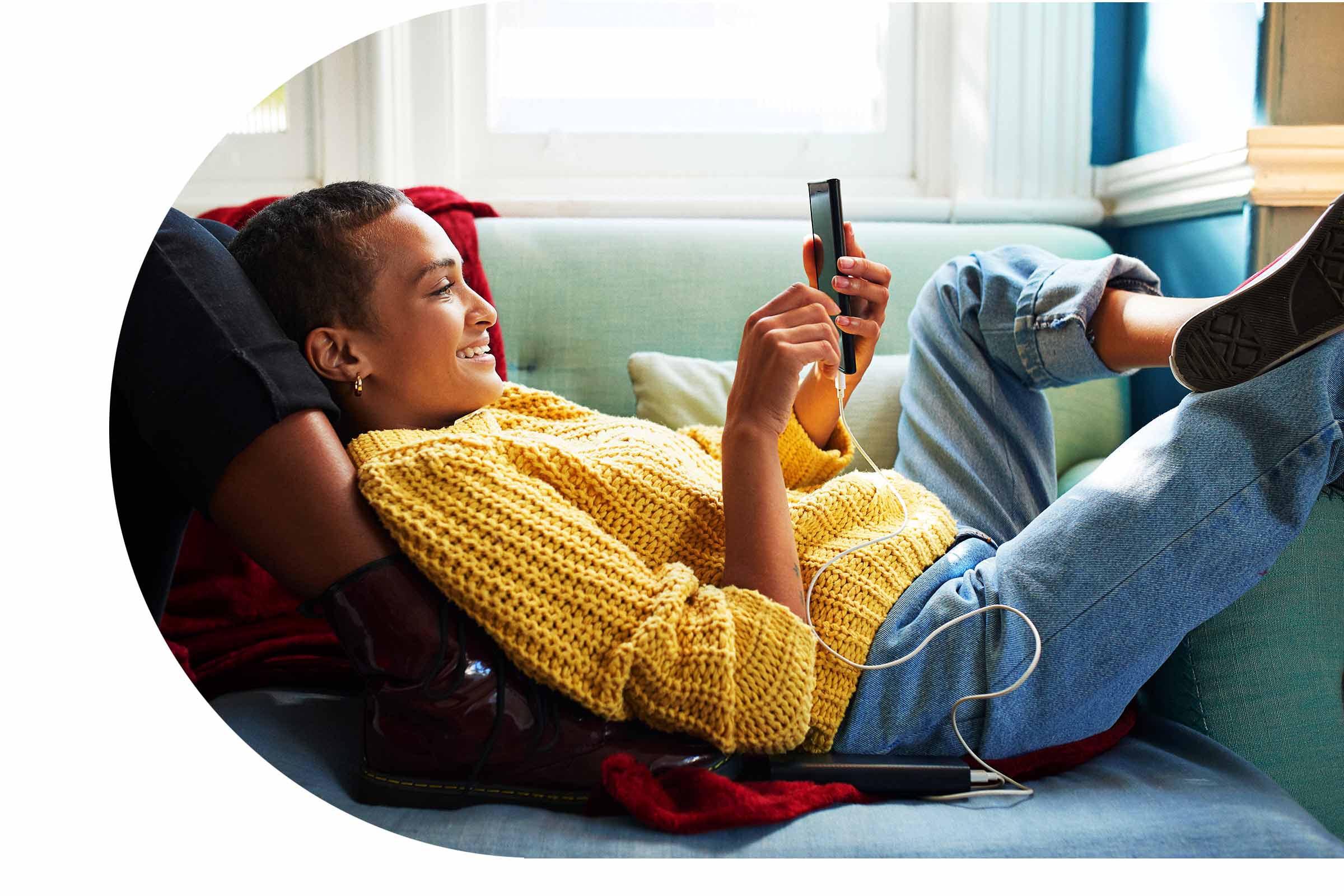 woman sitting relaxed on a yellow couch