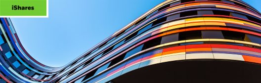 Curved building with bright colors against a blue sky