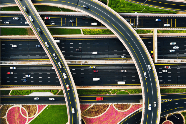 Multi-lane highway interchange with curved overpasses