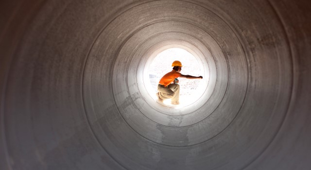 construction worker in a concrete tunnel