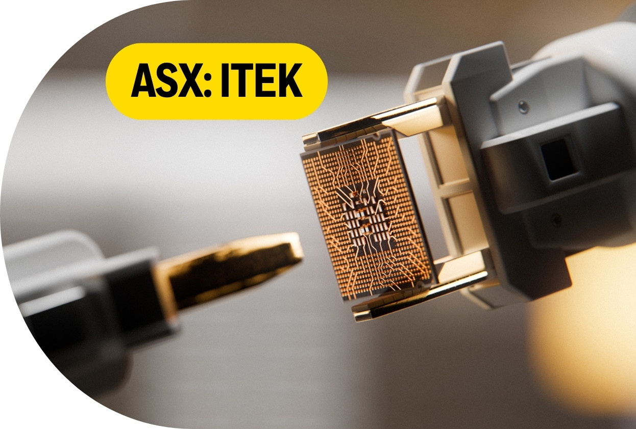 Close-up of a computer chip socket with the label “ASX: ITEK” in a yellow banner.
