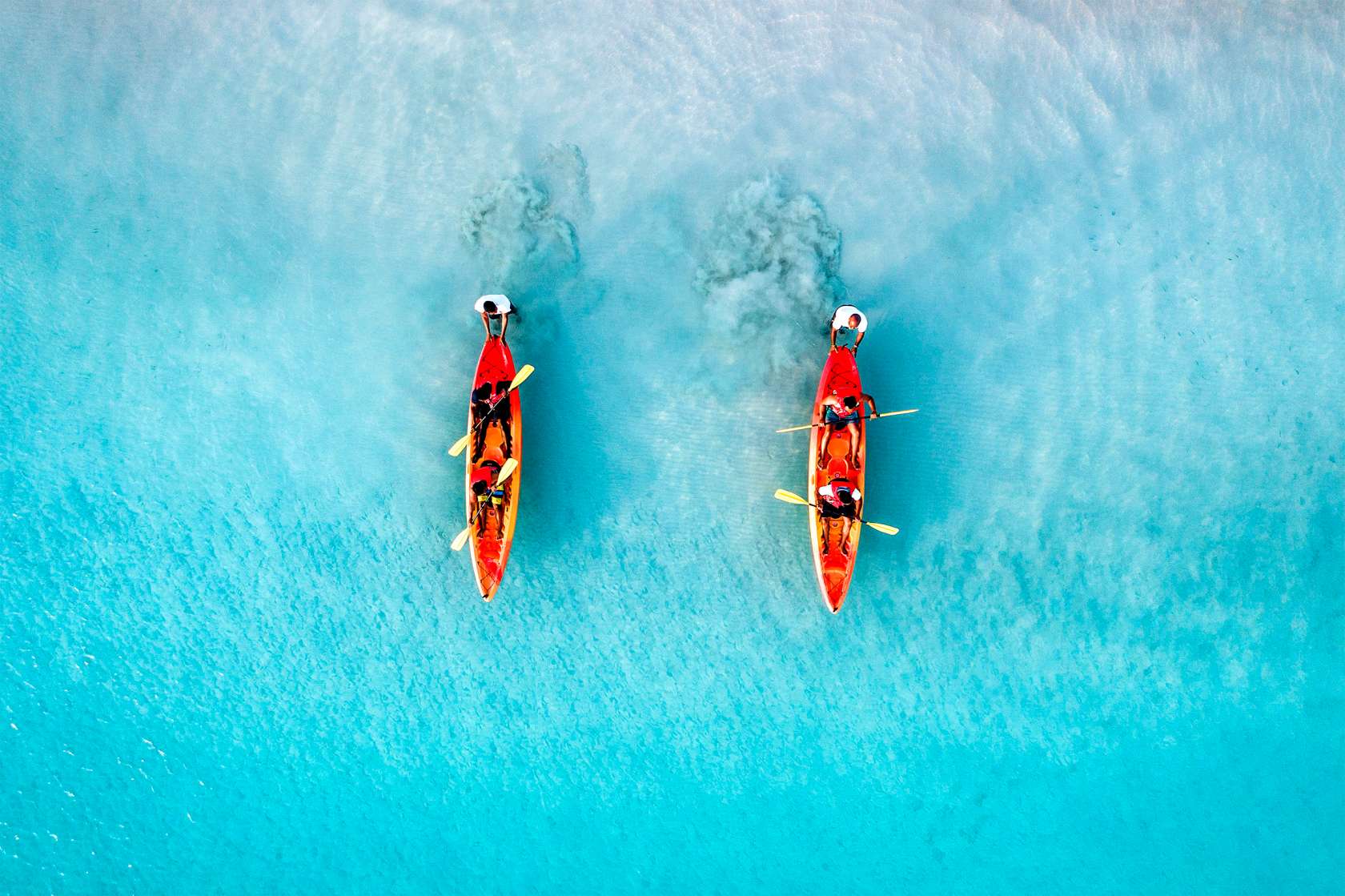 two kayaks rowing