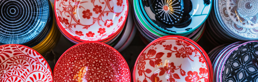 A top view of colorful ceramic bowls with various intricate patterns