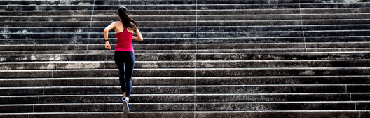 Runner ascending stone steps