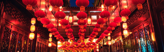 Red lanterns illuminating traditional Asian street