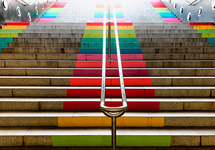 A rainbow-colored upwards stairwell.