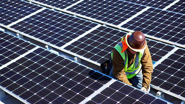Man working on solar panel field