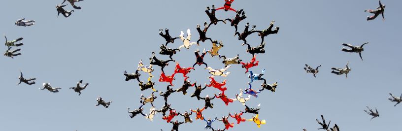 A group of parachuters in the sky