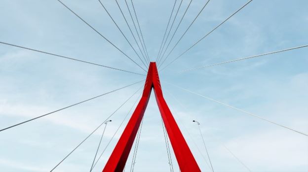 A red bridge with wires