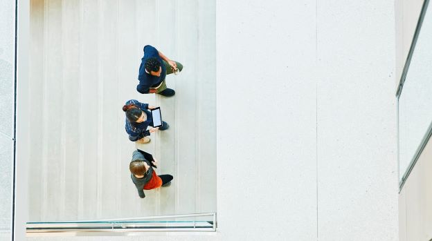 A group of people walking up the stairs
