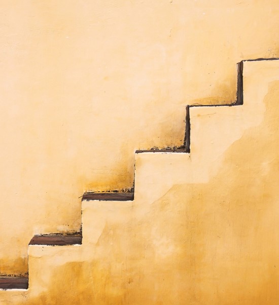 Light brown wall with a series of abstract