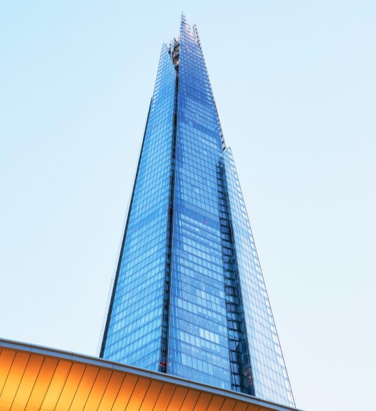 A tall, modern glass skyscraper