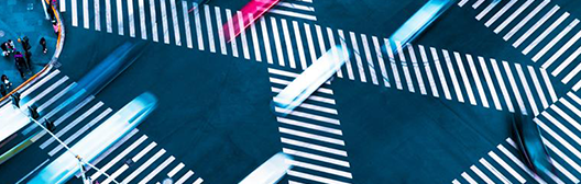 Photo of cars crossing a busy intersection