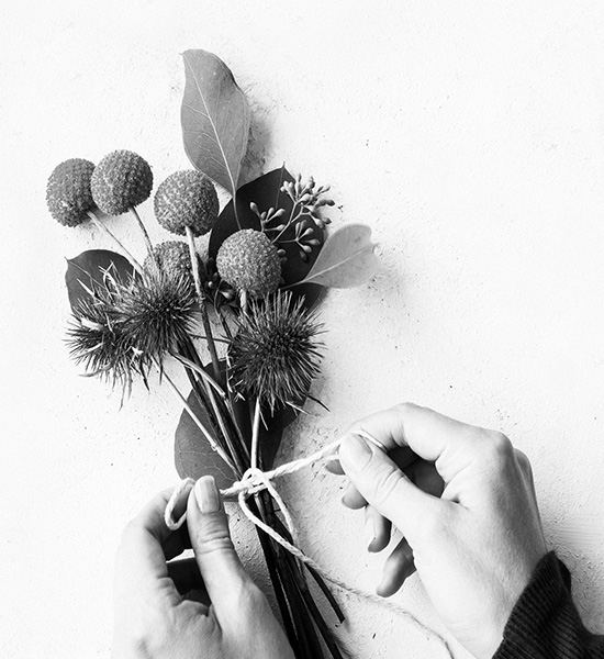 Black and white photo of a bundle of dried flowers representing an ETF basket of products