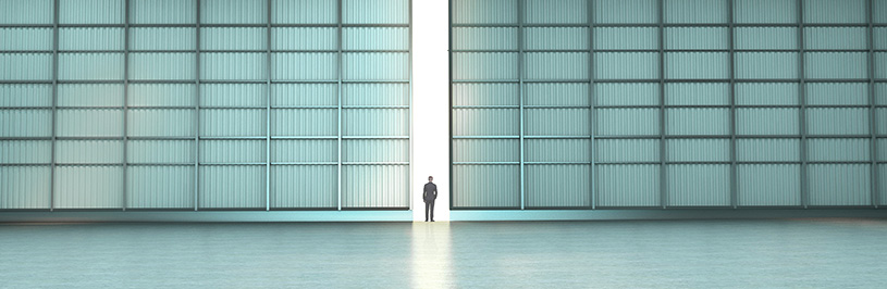 Man standing in the middle of an open door