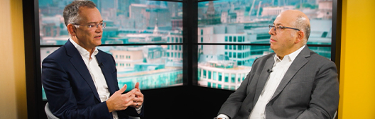 Image of arek Chouman, Global Head of the Aladdin Client Business and Hans Georgeson, CEO, Royal London Asset Management, sitting together talking 