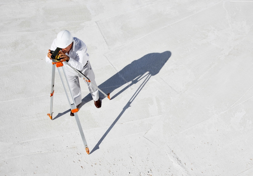 Image of a man looking through a telescope.