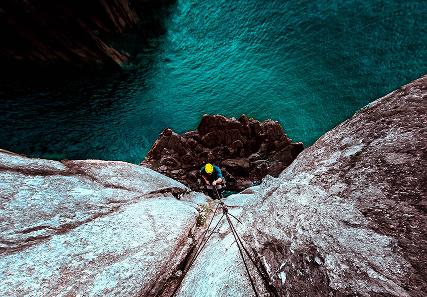 A climber scales a wall