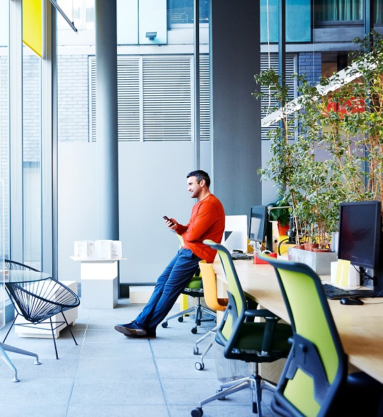 Man leaning against the table