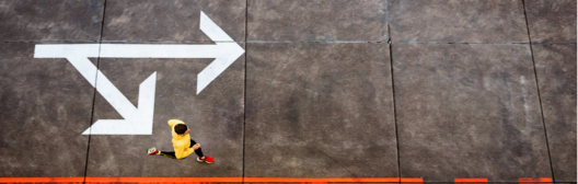 A man running near combination arrow