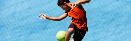 Boy playing with a ball