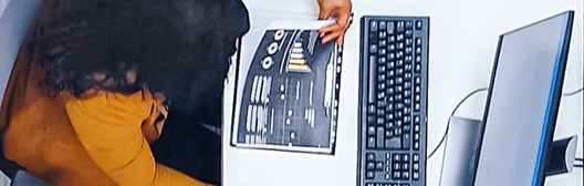 Women sitting in front of computer system