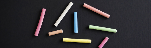Colorful chalk on black background