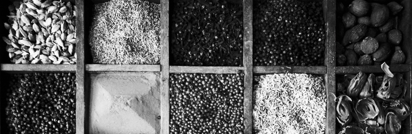 A variety of spices in a wooden box