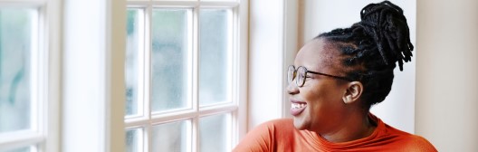 woman looking through window