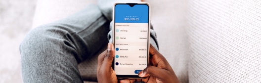 A person making a mobile payment, symbolizing the ease of accessing funds during retirement plan volatility.