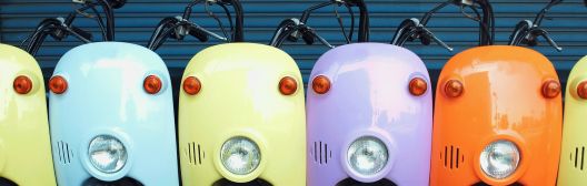 Image of multiple colored scooters
