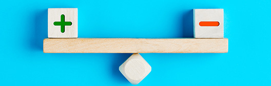 Two blocks balancing on a beam