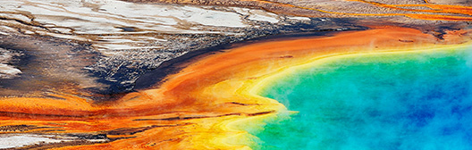 An aerial photo of large, colorful hot spring