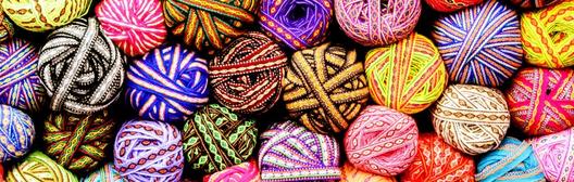 A vibrant pile of yarn balls symbolizes new opportunities in retirement.